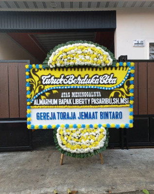 Papan Bunga Duka di Pengilon